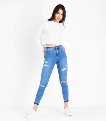 bright blue ripped jeans