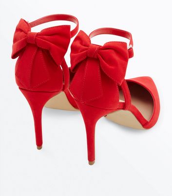 Red heels with sales bow on back