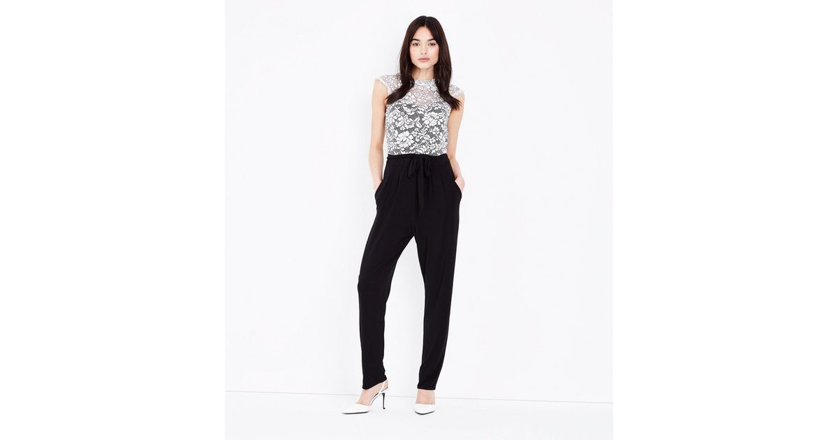 DRAPED FRONT BODICE JUMPSUIT WITH NECK TIE GLASSHOUSE ROMANCE