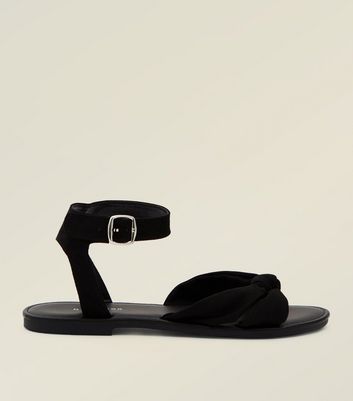 Black flat store sandals with bow