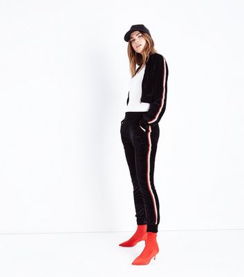 black tracksuit red stripe