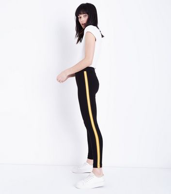 Black leggings with yellow stripe down the side on sale