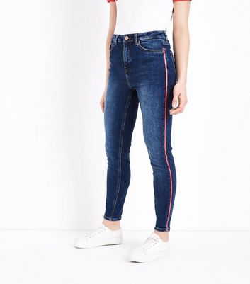 Skinny side 2025 stripe jeans