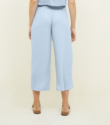 pale blue cropped trousers