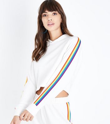 white sweatshirt with rainbow stripe