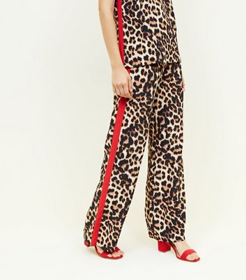 leopard print trousers with red stripe