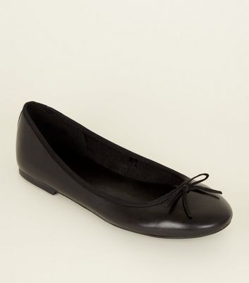 black leather flat pumps