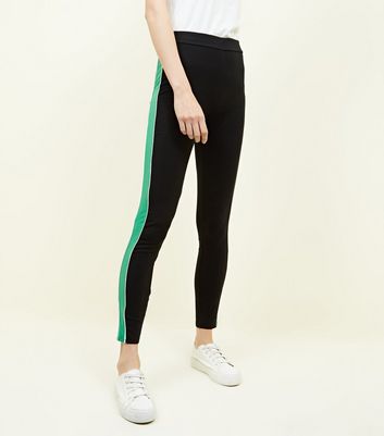 black pants with green stripe