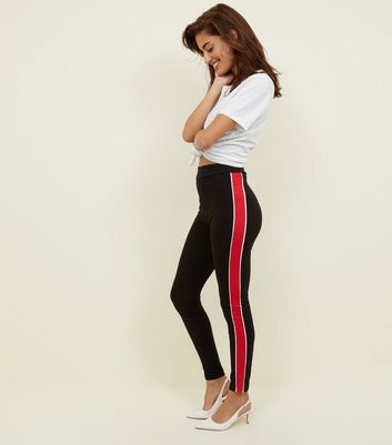 black pants with red stripe down the side