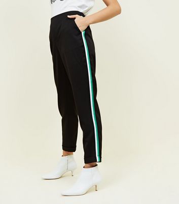 green trousers with side stripe