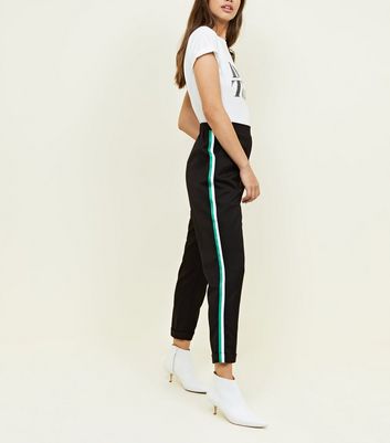 green trousers with side stripe