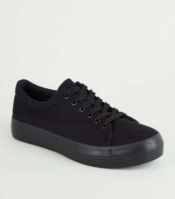 black flatform trainers
