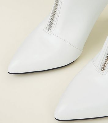 white zip front ankle boots