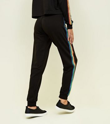 black joggers with rainbow stripe