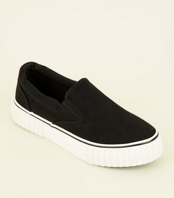 black canvas slip on trainers