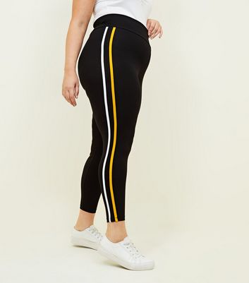 yellow leggings with black stripe