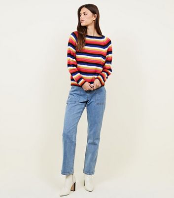 blue jumper with rainbow stripes