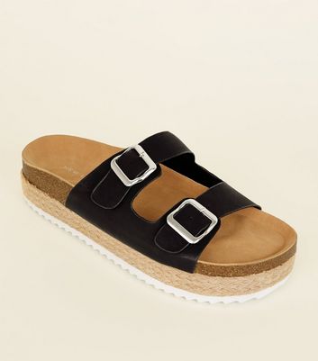 black buckle flatforms