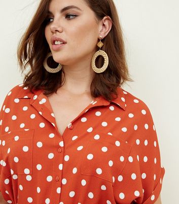 orange polka dot shirt