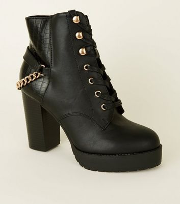 black ankle boots with chains