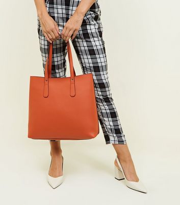 orange leather tote bag