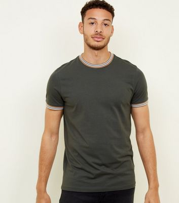 green t shirt black jeans