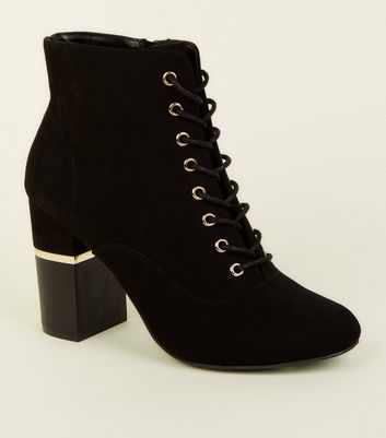black boots gold heel
