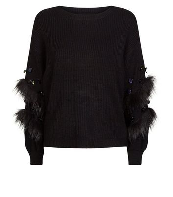 black jumper with fur sleeves