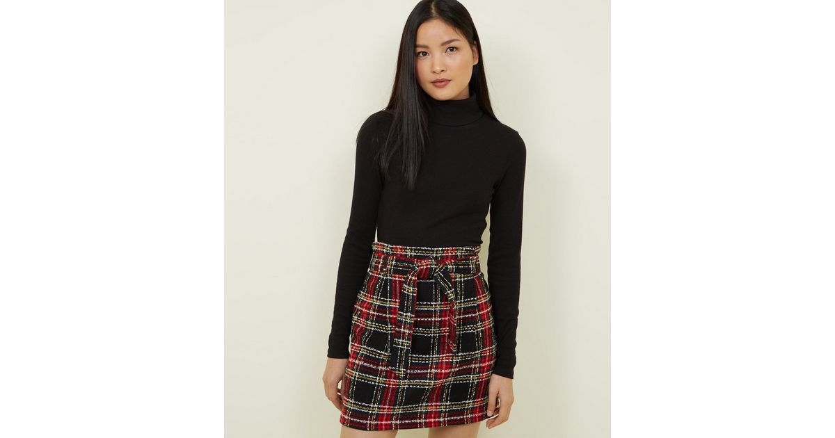 Mini-jupe noire en maille bouclée à carreaux et à taille haute à plis