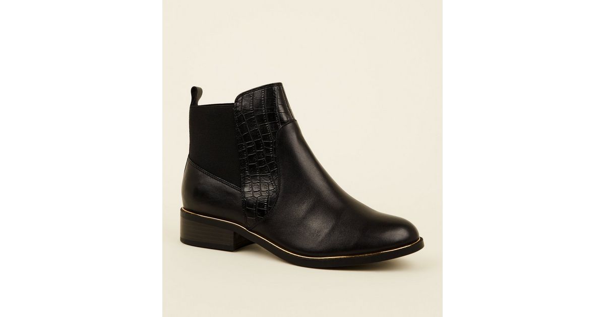 black metal trim chelsea boots