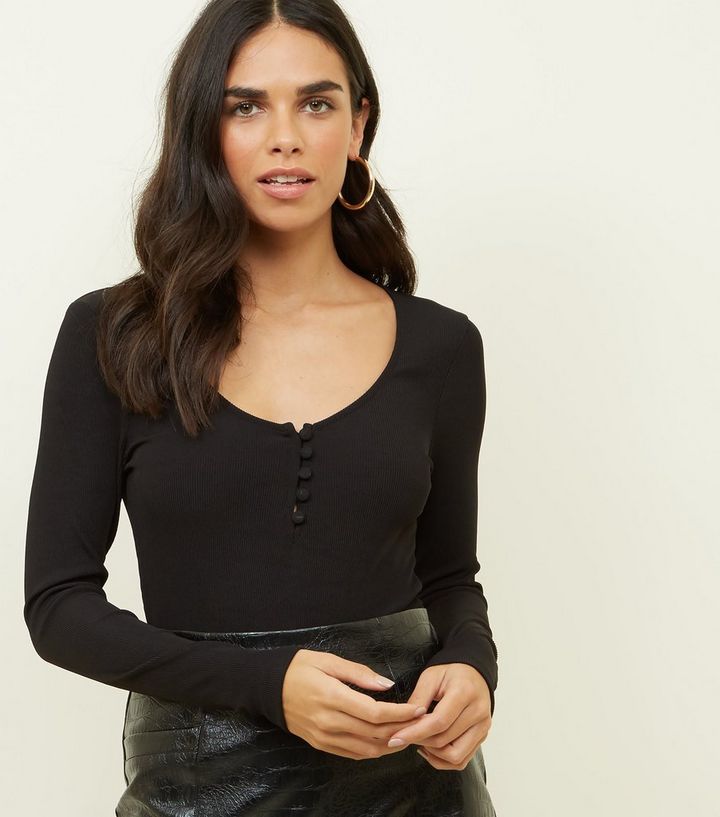 https://media2.newlookassets.com/i/newlook/604355201/womens/clothing/tops/black-button-front-ribbed-long-sleeve-bodysuit.jpg?strip=true&amp;qlt=80&amp;w=720