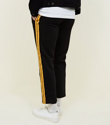 Yellow discount black joggers