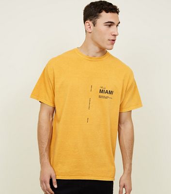yellow t shirt black jeans