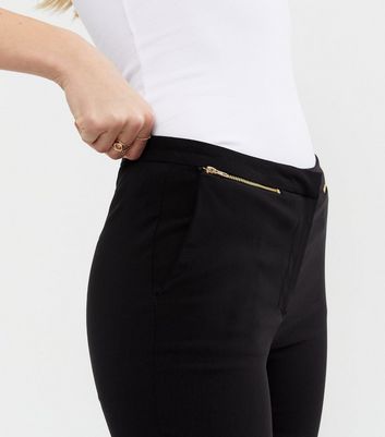 Damen Bekleidung Schwarze, schmale Hose aus Stretchmaterial mit Reißverschluss vorne