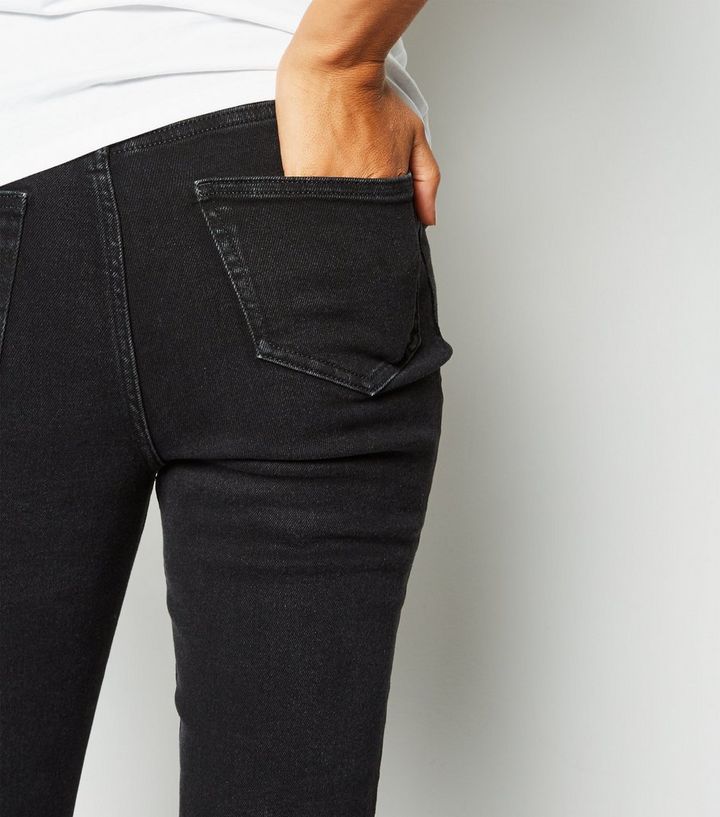 Umstandsmode Schwarze Zerrissene Skinny Jeans Mit Bund Unter Dem Babybauch New Look