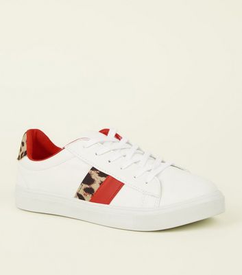 white and leopard trainers