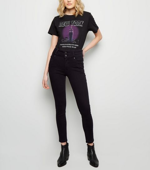 Jean skinny noir sculptant et push-up à taille haute