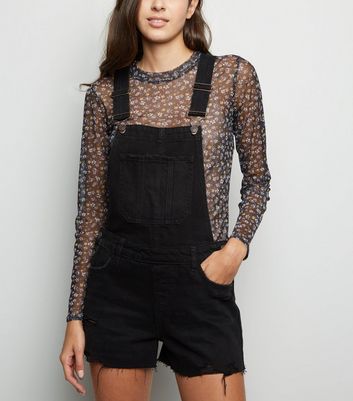 black ripped dungarees