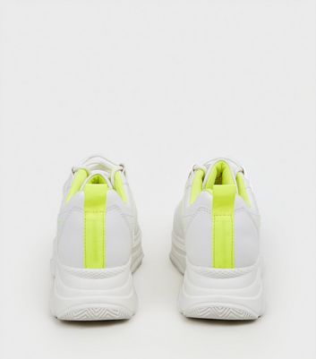 white and neon trainers