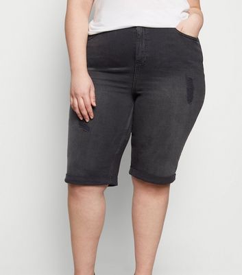 black ripped knee shorts