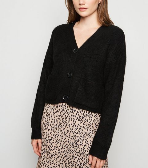 Schwarze Strickjacke mit aufgesetzten Taschen