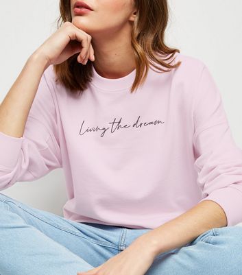 pink slogan sweatshirt