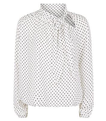 white blouse with black spots