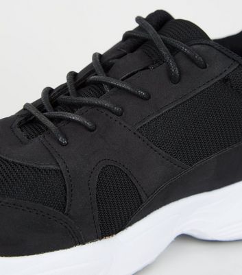 black sole trainers