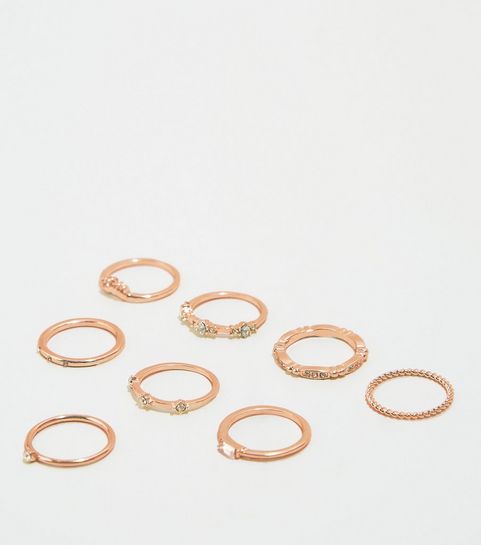 Lot de 8 bagues à superposer couleur or rose à strass