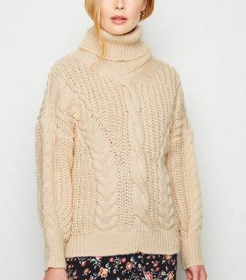 white cable knit roll neck jumper
