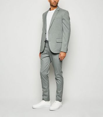 grey suit with trainers