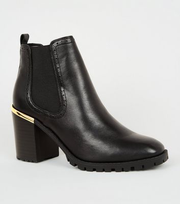 heeled brogue boots