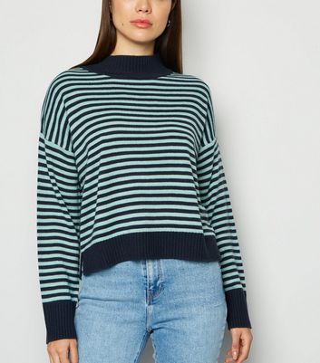 grey jumper and blue jeans