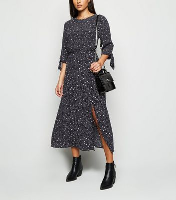 black spotted midi dress